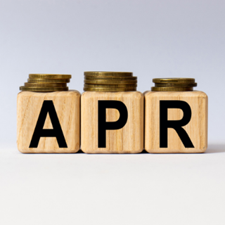 the word APR made from wooden blocks