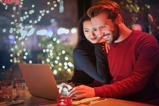 Couple shopping online, Christmas 2023