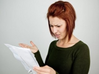 confused woman looking at document