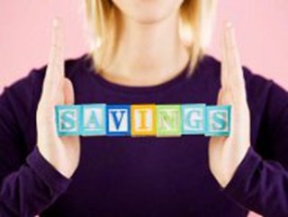 woman holding savings blocks