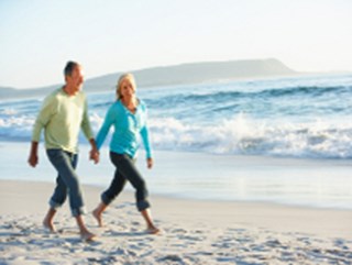 retiree walking on a beach