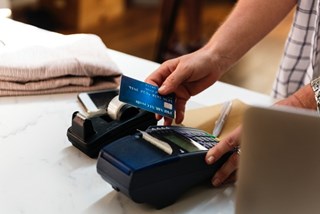 woman shopping using bank card
