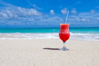 cocktail on the sand by the ocean