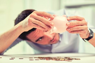 Looking for higher returns on you savings? | Person emptying piggybank