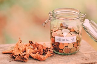 retirement money jar in autumnal setting