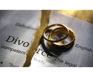Divorce paperwork and wedding rings