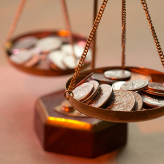 coins on a balancing scale