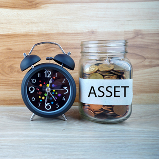 Clock next to a jar with a label reading asset