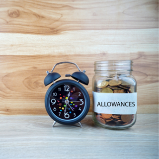 Jar labelled allowances, next to an alarm clock