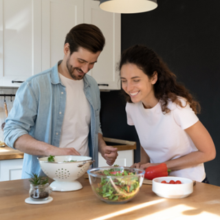 two people laughing in a kitchen